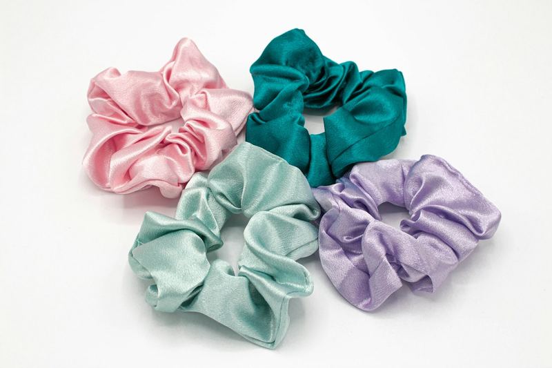 Four satin scrunchies in pink, teal, mint and lilac